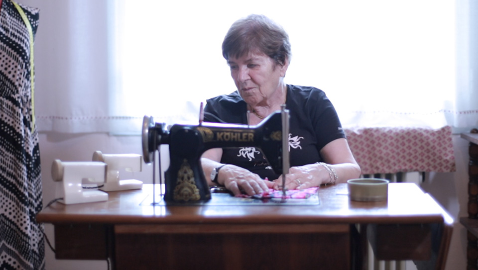 A woman using a sewing machine.